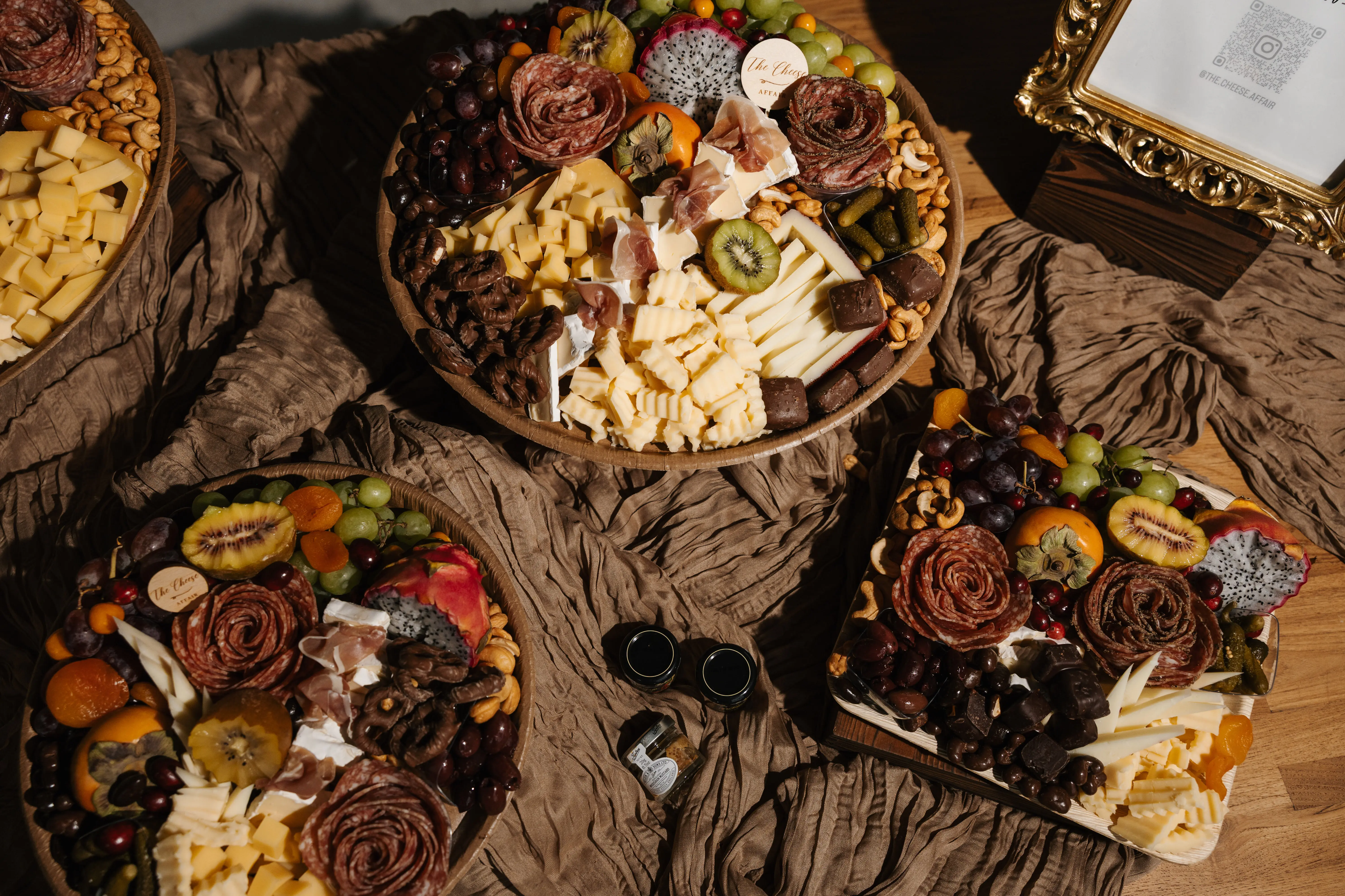 A signature charcuterie board with fruit, cheese, and elevated presentation