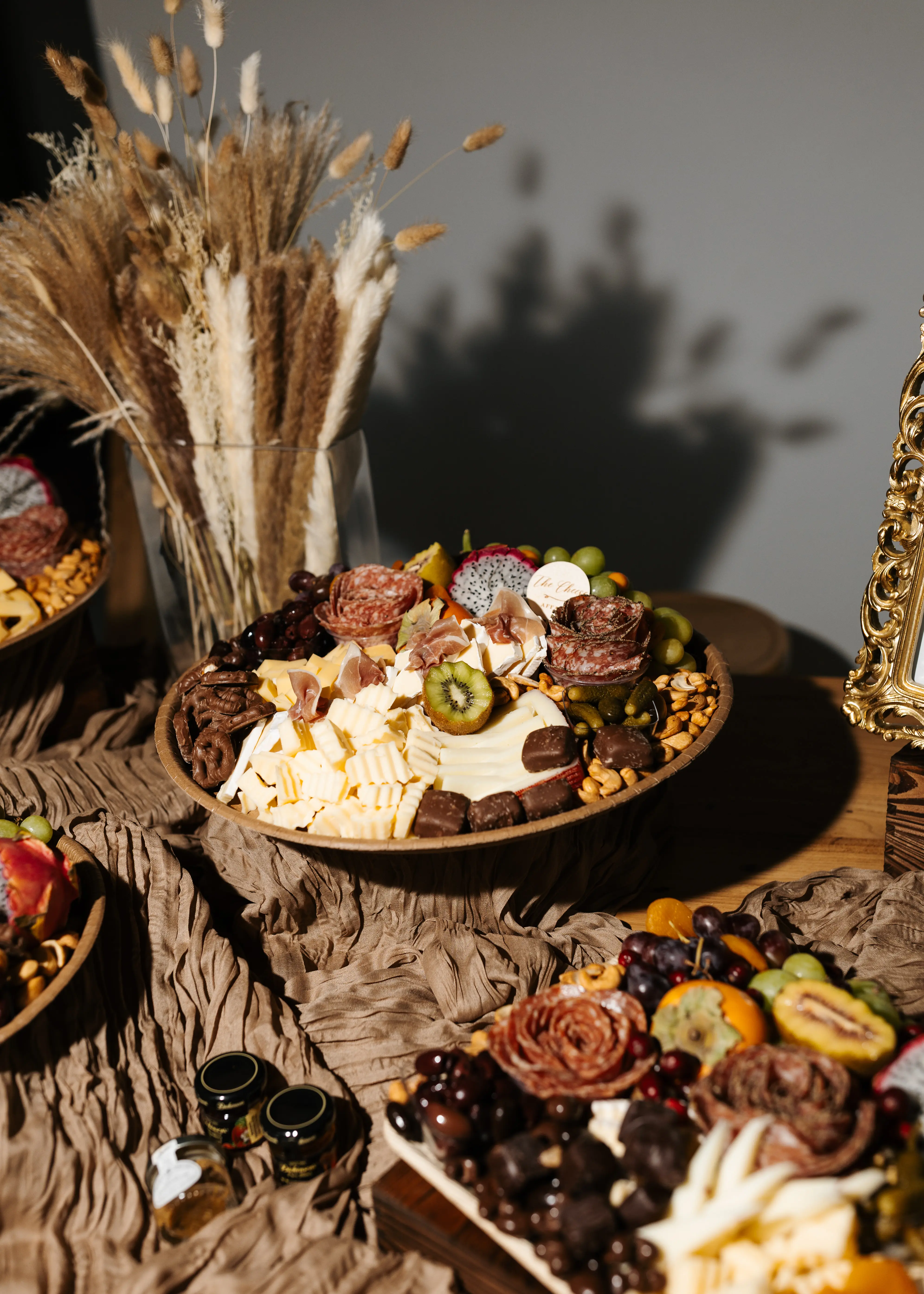 A close up charcuterie arrangement with texture, fruit, and styling details